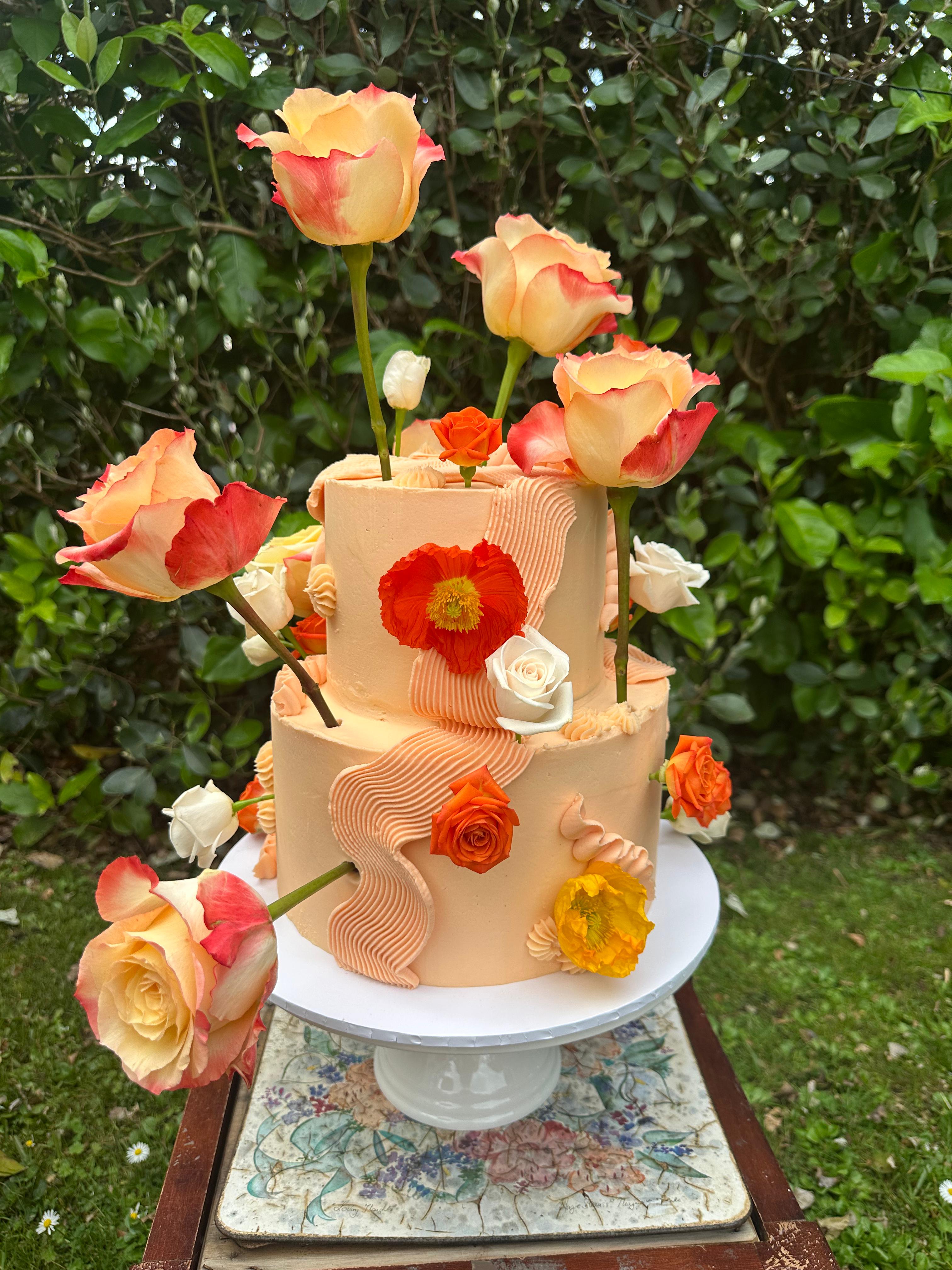 Custom wedding cake Auckland – floral tiered design by Ruby Cakes Boutique